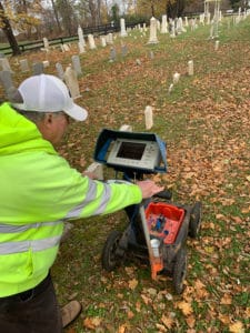 Matt Turner of GeoModel shown scanning the cemetery